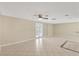 Bright living room with tile floors and access to patio at 3234 Jackson Dr, Holiday, FL 34691