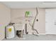 Unfinished basement with utility sink and water heater at 3234 Jackson Dr, Holiday, FL 34691