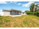 Spacious backyard with screened patio, offering a relaxing outdoor space at 3234 Jackson Dr, Holiday, FL 34691
