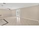 Bright living room with tile floors and access to a patio at 3234 Jackson Dr, Holiday, FL 34691