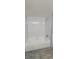 Bathroom with a white subway tile shower, a deep soaking tub, and wood-look floors at 1370 Heather Ridge Blvd # 107, Dunedin, FL 34698