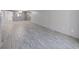 Open living room features tile flooring and a neutral color palette at 1370 Heather Ridge Blvd # 107, Dunedin, FL 34698
