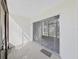 Enclosed patio with sliding glass doors leading inside at 1370 Heather Ridge Blvd # 107, Dunedin, FL 34698
