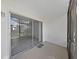Enclosed patio with sliding glass doors leading inside at 1370 Heather Ridge Blvd # 107, Dunedin, FL 34698