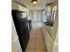 Kitchen with black appliances and tile floors at 9209 Dalwood Ct, Tampa, FL 33615