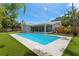 Inviting pool area with spacious deck and fenced backyard at 1921 Blue Heron Way, Palm Harbor, FL 34683