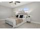 Bedroom with queen bed, nightstands, and closet at 1921 Blue Heron Way, Palm Harbor, FL 34683