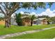Ranch style home with stone and wood accents at 1921 Blue Heron Way, Palm Harbor, FL 34683