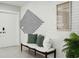 Stylish entryway with white brick feature wall, bench, and accent pillows at 1921 Blue Heron Way, Palm Harbor, FL 34683