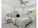 Spacious bedroom with a queen bed, nightstands, and ample closet space at 1921 Blue Heron Way, Palm Harbor, FL 34683