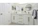 Modern bathroom with double vanity and large mirrors at 1921 Blue Heron Way, Palm Harbor, FL 34683