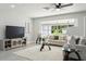 Bright living room with large windows and seating area at 1921 Blue Heron Way, Palm Harbor, FL 34683