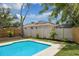 Relaxing pool area with lush landscaping at 1921 Blue Heron Way, Palm Harbor, FL 34683