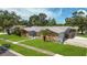 Ranch style home with stone and wood exterior at 1921 Blue Heron Way, Palm Harbor, FL 34683