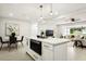 Open concept kitchen with island and breakfast bar at 1921 Blue Heron Way, Palm Harbor, FL 34683