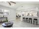 Open concept living space with kitchen view and breakfast bar at 1921 Blue Heron Way, Palm Harbor, FL 34683