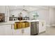 Modern kitchen with gold sink and stainless steel appliances at 1921 Blue Heron Way, Palm Harbor, FL 34683