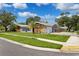 Ranch style home with stone and wood accents at 1921 Blue Heron Way, Palm Harbor, FL 34683