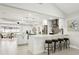 Modern kitchen with white cabinets, large island, and stainless steel appliances at 1921 Blue Heron Way, Palm Harbor, FL 34683