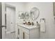 Modern bathroom with double vanity and large mirrors at 1921 Blue Heron Way, Palm Harbor, FL 34683