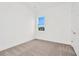 Spacious bedroom with neutral carpeting and large window at 32252 Wetland Bird Vw, San Antonio, FL 33576