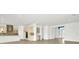 Modern kitchen with an island, stainless steel appliances, and white cabinetry at 32252 Wetland Bird Vw, San Antonio, FL 33576