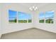 Bright dining room with large windows overlooking a lake at 32252 Wetland Bird Vw, San Antonio, FL 33576