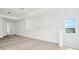 Bonus room with window, carpet, and white walls at 32252 Wetland Bird Vw, San Antonio, FL 33576