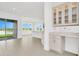Built-in kitchen cabinetry and a breakfast bar with views into the living room at 32252 Wetland Bird Vw, San Antonio, FL 33576