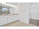 Modern bathroom boasts double vanity, walk-in closet, and grey tile at 32252 Wetland Bird Vw, San Antonio, FL 33576