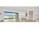 Bright and spacious living area with tile floors and sliding glass doors leading to a lake view at 32252 Wetland Bird Vw, San Antonio, FL 33576