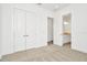 Spacious bedroom with double doors to a closet and bathroom at 32252 Wetland Bird Vw, San Antonio, FL 33576