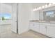 Bright bathroom features double vanity and a view of the bedroom at 32252 Wetland Bird Vw, San Antonio, FL 33576