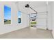 Spacious garage with automatic opener and windows at 32252 Wetland Bird Vw, San Antonio, FL 33576