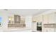 Modern kitchen with stainless steel appliances and light-colored cabinetry at 32252 Wetland Bird Vw, San Antonio, FL 33576