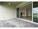 Covered patio with view into the kitchen and backyard at 32252 Wetland Bird Vw, San Antonio, FL 33576
