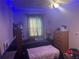 Cozy bedroom with a double bed and wood dresser at 9463 Arbol Ct, Largo, FL 33773