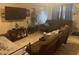 Living room with comfortable seating and a large-screen TV at 9463 Arbol Ct, Largo, FL 33773