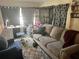 Bright living room with a sofa and workspace at 1161 Kingsley St, Clearwater, FL 33756