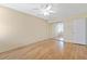 Empty bedroom featuring wood flooring and mirrored closet at 7100 Sunset Way # 906, St Pete Beach, FL 33706