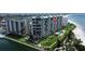 High-rise beachfront condominium building with pool and tennis courts at 7100 Sunset Way # 906, St Pete Beach, FL 33706