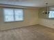 Spacious dining area with large window and neutral carpeting at 4681 1St Ne St # 309, St Petersburg, FL 33703