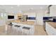 Open kitchen with granite countertops, stainless steel appliances, and breakfast bar at 6419 Marbella Blvd, Apollo Beach, FL 33572