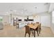 Spacious kitchen and dining area with a large island, stainless appliances, and ample seating at 6419 Marbella Blvd, Apollo Beach, FL 33572