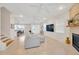 Bright living room featuring neutral tones, tile flooring, a fireplace and an open floor plan at 6419 Marbella Blvd, Apollo Beach, FL 33572