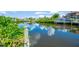 Picturesque water view with a boat lift and surrounding homes, creating a peaceful waterfront setting at 6419 Marbella Blvd, Apollo Beach, FL 33572