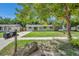 Front yard view of a charming house with a tree at 6430 Willow Wood Ln, Tampa, FL 33634