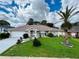 Single story home with manicured lawn at 1460 Overland Dr, Spring Hill, FL 34608