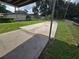 Large concrete parking area behind the house at 3208 E Powhatan Ave, Tampa, FL 33610