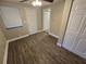 Bedroom with wood-look floors and a ceiling fan at 3208 E Powhatan Ave, Tampa, FL 33610